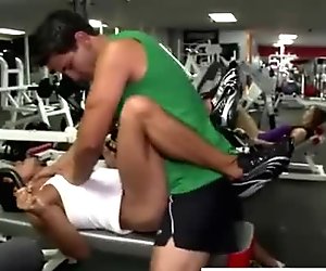 Sporty guy gives a blowjob in the gym