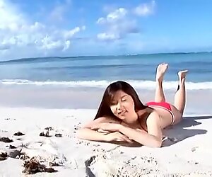 Scorching pale skin beauty China Fukunaga flaunts her curves on the beach